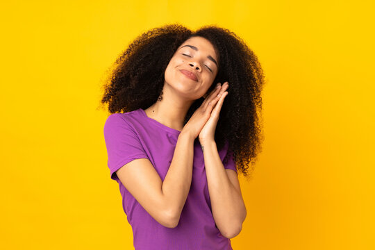 Young African American Woman Over Isolated Background Making Sleep Gesture In Dorable Expression