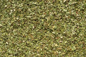 Pile of dried green oregano texture or background. - obrazy, fototapety, plakaty