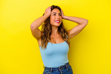 Young caucasian woman isolated on yellow background