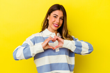 Young caucasian woman isolated on yellow background