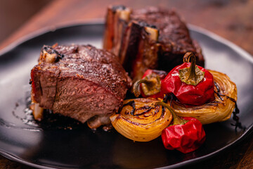 roast beef cut beef rib with pepper onion and arugula salad and lettuce