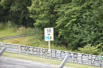 information sign on the side of race track