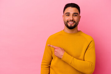 Young mixed race man isolated on pink background