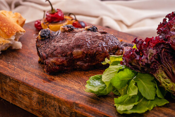 roast beef cut beef rib with pepper onion and arugula salad and lettuce