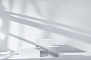 Background for product presentation with shadows and light. Empty podiums. Mockup.