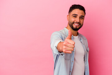 Young mixed race man isolated on pink background