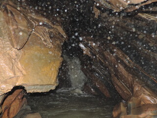 water flowing from the cave