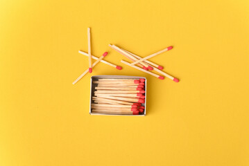 Red matches on the yellow background.