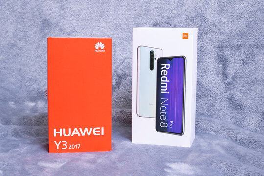 BELARUS, NOVOPOLOTSK - 14 MARCH, 2021: Two boxes of mobile phones Hyawei Y3 and Xiaomi redmi 8 pro