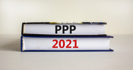 PPP, paycheck protection program 2021 symbol. Concept words PPP, paycheck protection program 2021 on books on a beautiful white background. Business, PPP paycheck protection program 2021 concept.