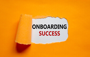 Onboarding success symbol. Words 'Onboarding success' appearing behind torn orange paper. Beautiful orange background. Business, onboarding success concept, copy space.