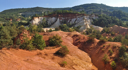 Red and white rocks in the south of France at the site of a former quarry - Colorado de Rustrel, France