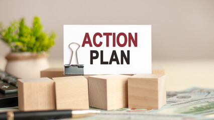 piece of paper with the text: action plan, business and finance concept