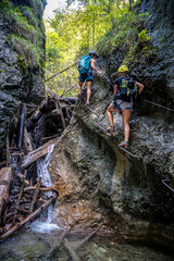 Adventure hiking trail through canyon in Slovak paradise national park, Slovakia.  Via ferrata in canyon Kysel. Discovery travel concept.