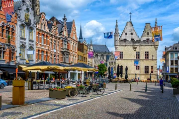 Fotobehang Old street with tables of cafe in Mechelen, Belgium. Mechelen is a city and municipality in the province of Antwerp, Flanders, Belgium. © Ekaterina Belova