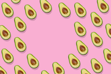 Avocado pattern on bright pink background with free space for text