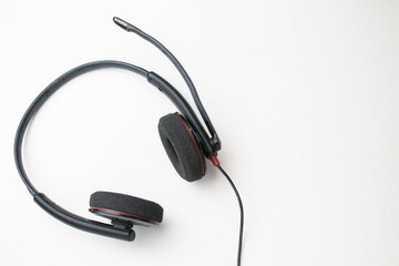 Headphones with microphone on a white background.