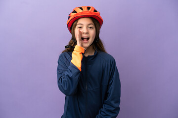 Little caucasian girl isolated on purple background shouting with mouth wide open