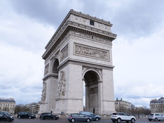 Fototapeta na wymiar The Arc de Triomphe in Paris during a cloudy day. The Sunday 14th March 2021.