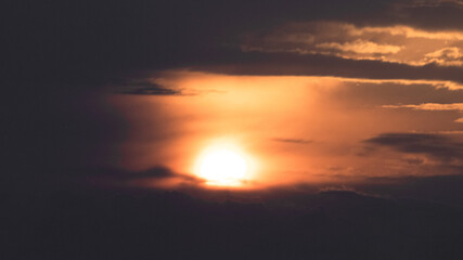 Fototapeta na wymiar Sunrise within the clouds