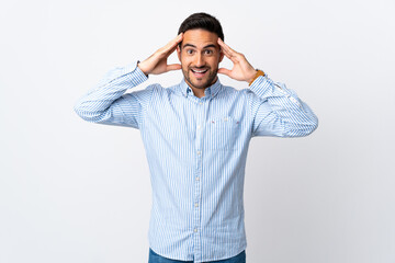 Young handsome man over isolated background with surprise expression