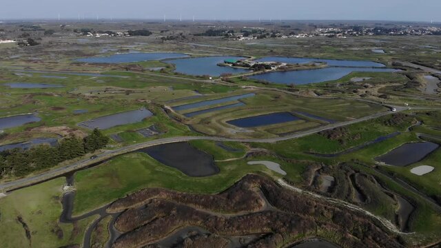 aerial view of salt marshes on the island of Noirmoutiers in France. Sunset on French salt march with a blue sky and the blue reflection on the water