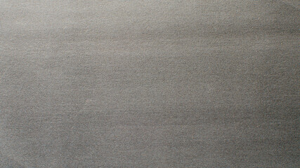 Fototapeta na wymiar gray background of fine sandpaper