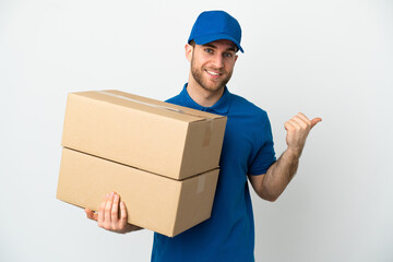 Delivery man over isolated white background pointing to the side to present a product