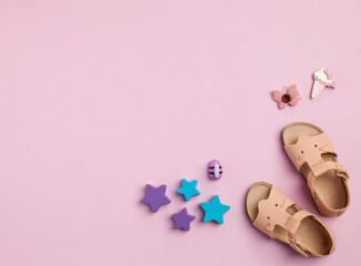 Cute pink shoes for girls on a pink background. Flatlay. Copy space.