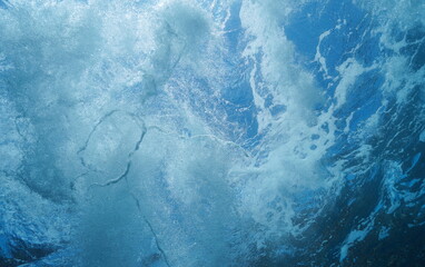 Underwater sea foam made by waves below water surface in the ocean, natural scene, Atlantic