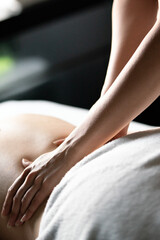 Fototapeta premium Young and healthy woman in spa salon. Traditional massage therapy and beauty treatments.