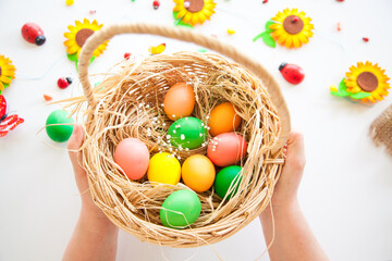 Easter pattern of Eggs with flowers and candies on the white background. Easter concept. Healthy feeding concept.