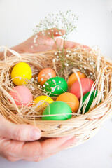 Easter pattern of Eggs with flowers and candies on the white background. Easter concept. Healthy feeding concept.