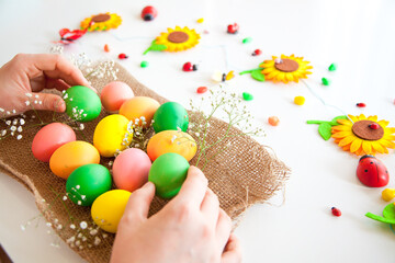 Easter pattern of Eggs with flowers and candies on the white background. Easter concept. Healthy feeding concept.