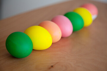 Easter pattern of Eggs with flowers and candies on the white background. Easter concept. Healthy feeding concept.