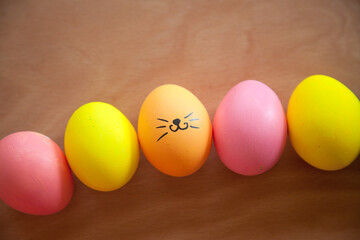 Easter pattern of Eggs with flowers and candies on the white background. Easter concept. Healthy feeding concept.