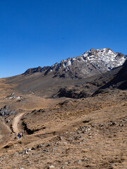 Landscape with people in a path to a mountain with ice, in huancayo, peru