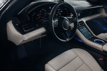 Car interior with white leather seats and dashboard