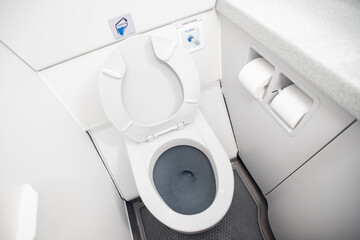 Airplane passenger lavatory toilet seat and water wash basin
