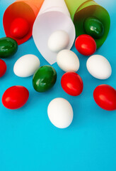 Happy Easter holiday card, Easter eggs as the color of the Italian flag - green, white, red	
