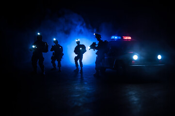 Anti-riot police give signal to be ready. Government power concept. Police in action. Smoke on a...