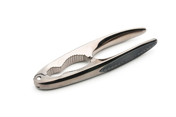 Fototapeta premium Tongs for nuts on a white background