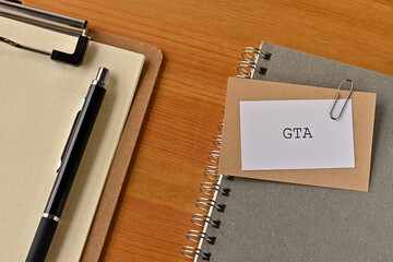 There is a piece of paper with the word GTA written on it. It was an abbreviation for Grounded Theory Approach.