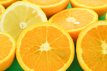 Juicy sliced oranges and lemons fruit background,seasonal citrus fruits,healthy eating