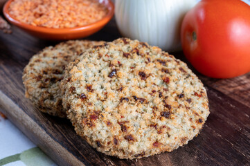 Tasty vegetarian food, burgers made from orange lentils legumes with sun dried tomatoes