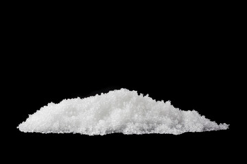 Heap of white snow isolated on black background