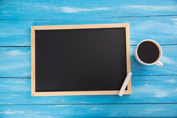 blackboard with chalk and cup of coffee