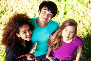 cute group of teenages at the building of university with books huggings, diversity nations, having lunch