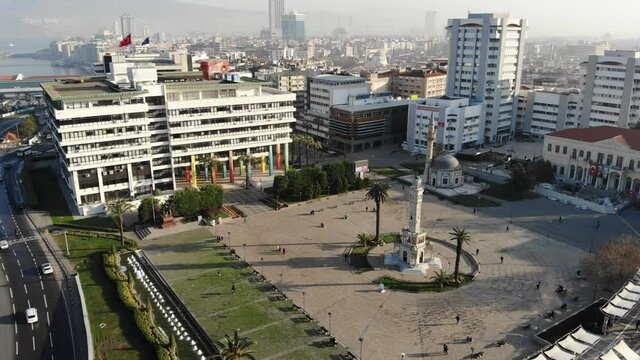 General aerial view of Konak Square with Izmir Clock Tower and Yali Mosque on sunny winter day, Izmir, Turkey. High quality 4k footage