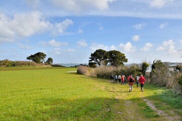 group of senior hikers on a path in Brittany